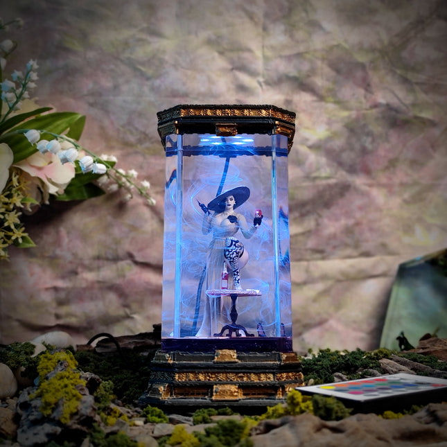Decorative lamp with a figure inside, surrounded by flowers and foliage on a textured background