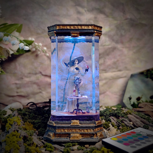 Decorative lamp with a figurine inside, surrounded by flowers and a blurred background