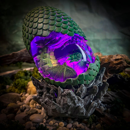 Side view of the Dragon Egg lamp showcasing professional resin clarity.