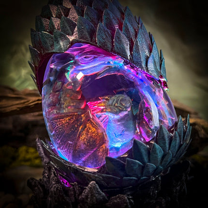 Close-up of Forest Dragon resin lamp showing detailed mossy scales and eggshell textures.