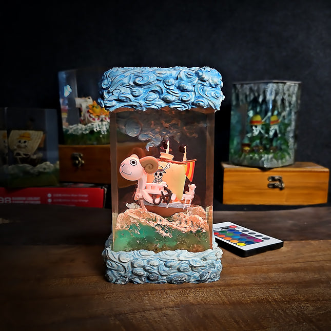 Decorative lamp with turtle and ship design on a wooden surface
