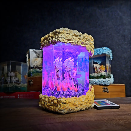 Decorative lamp with colorful light and floral design on a dark background