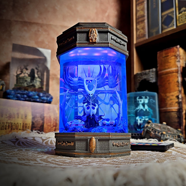 Handmade Hollow Knight lamp with glowing blue scene.