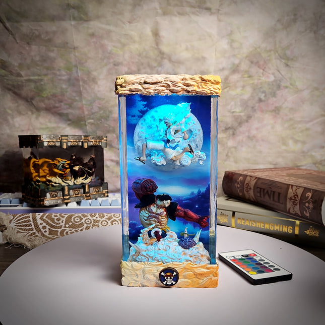 Decorative lamp with animated characters on a table with books and a remote control.