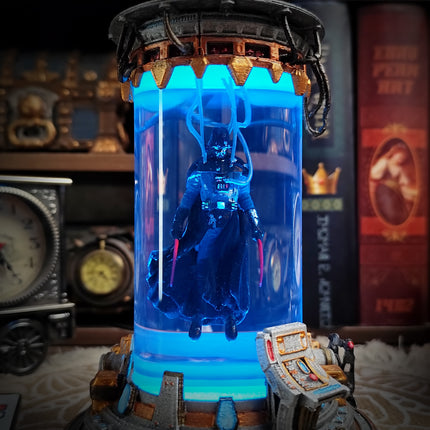 Decorative item with a blue light bulb and mechanical components on a shelf.