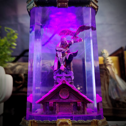 Decorative lamp with a character inside, glowing purple, on a blurred background