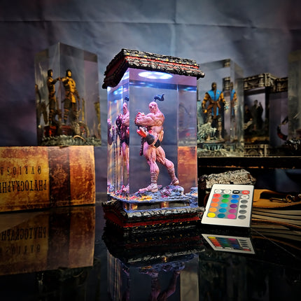 Clear glass display case with a muscular figure on a reflective surface