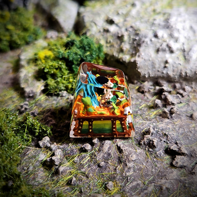 Miniature figurine scene on a rock with greenery